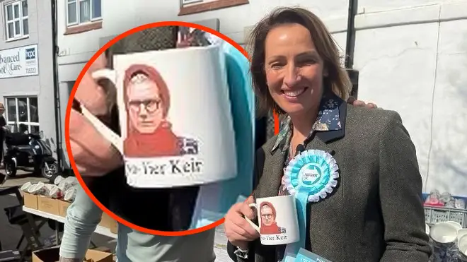 Sarah Pochin smiling and holding a Two-Tier Keir mug
